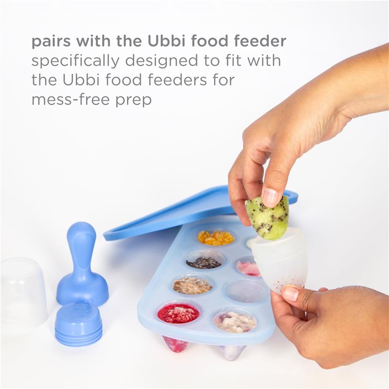 Ubbi Smoothie Feeder and Freezer Tray Set in purple and green, with a hand inserting fruit into a feeder tray.