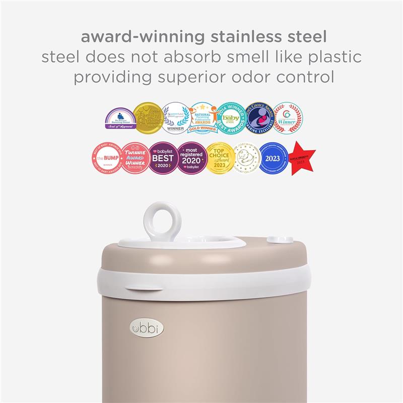 Ubbi stainless steel diaper pail in taupe, featuring a top lid with a handle and various award stickers highlighting its odor control.