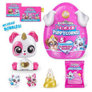 Bobblehead puppy toy with pink and white features, plus accessories and a foil bag for Rainbocorns Pocket Puppycorns.