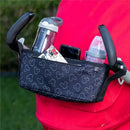 Universal Stroller Organizer featuring a black Mickey Mouse pattern, holding a water bottle, phone, and baby bottle.