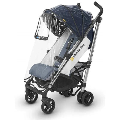 UPPAbaby 2018 G-Series Rain Shield covering a stroller, featuring clear plastic sides and a blue canopy.