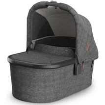 UPPAbaby Bassinet V3 in Charcoal Mélange with a carbon frame, designed to be compatible with Vista, Cruz, Ridge, and Minu strollers.