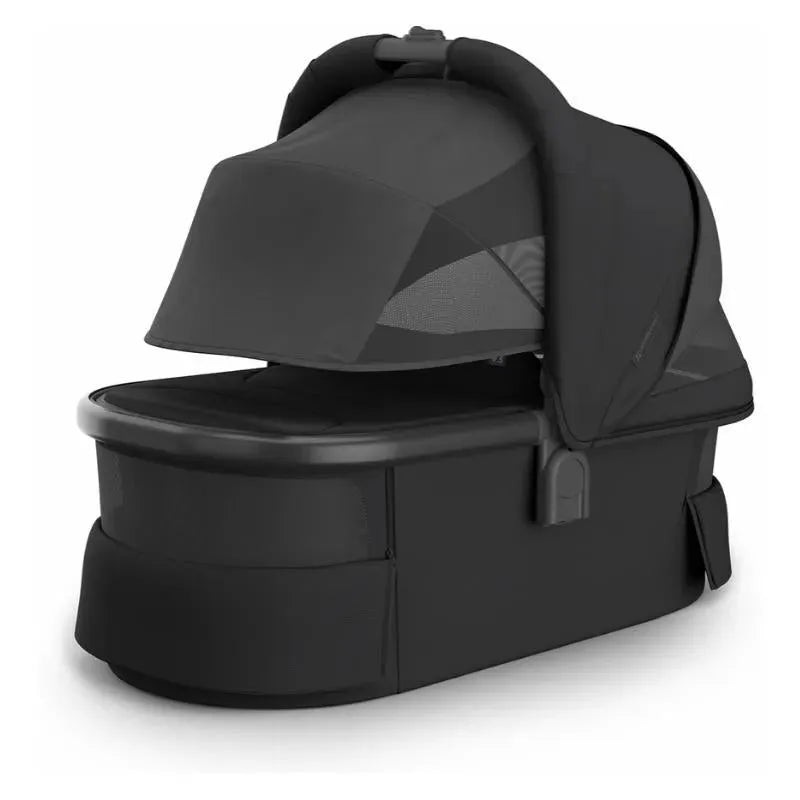 Uppababy Bassinet V3 in Charcoal with a carbon frame, featuring a covered top and mesh side panels for ventilation.