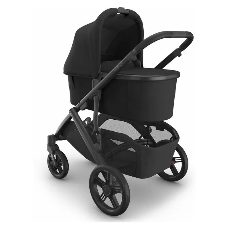 Uppababy Bassinet V3 in charcoal with a carbon frame, featuring a sleek design and large wheels for easy mobility.