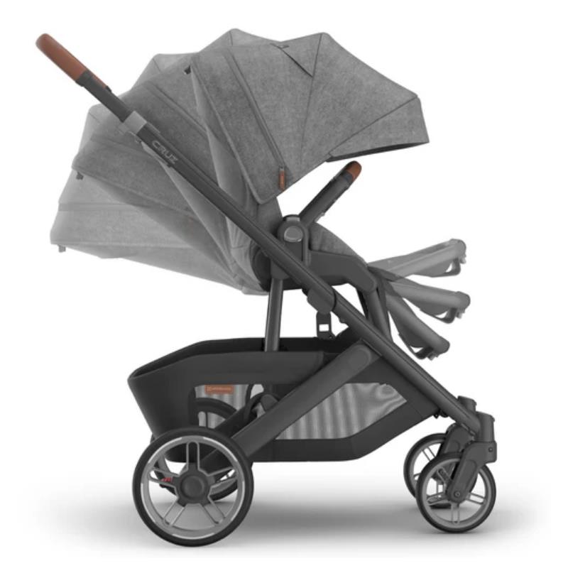 Uppababy Cruz V3 stroller in Charcoal Mélange with carbon frame and saddle leather handle, featuring an adjustable canopy.