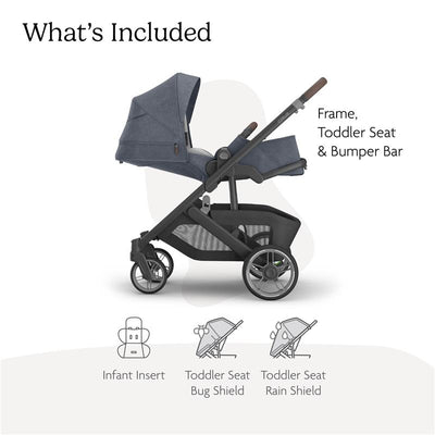 Uppababy Cruz V3 stroller in Dusty Blue Mélange with carbon frame and chestnut leather, showing included toddler seat and bumper bar.