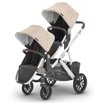 Uppababy Declan Vista V3 stroller with Declan Rumbleseat, featuring two seats, adjustable canopies, and a sleek design.