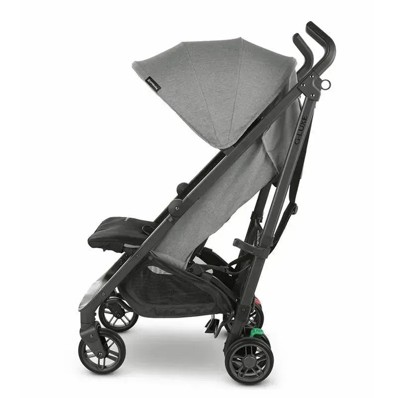 Lightweight UPPAbaby G-LUXE Umbrella Stroller in Greyson color, featuring a charcoal melange fabric and a foldable design.