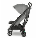 Lightweight UPPAbaby G-LUXE Umbrella Stroller in Greyson color, featuring a charcoal melange fabric and a foldable design.