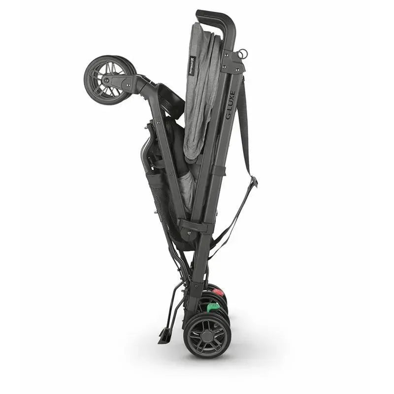 UPPAbaby G-LUXE Umbrella Stroller in Charcoal Melange, shown in a folded position for easy transport.