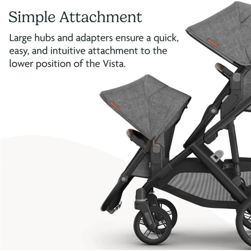 Kenzi Vista V3 stroller showcasing simple attachment with large hubs and adapters for easy use.