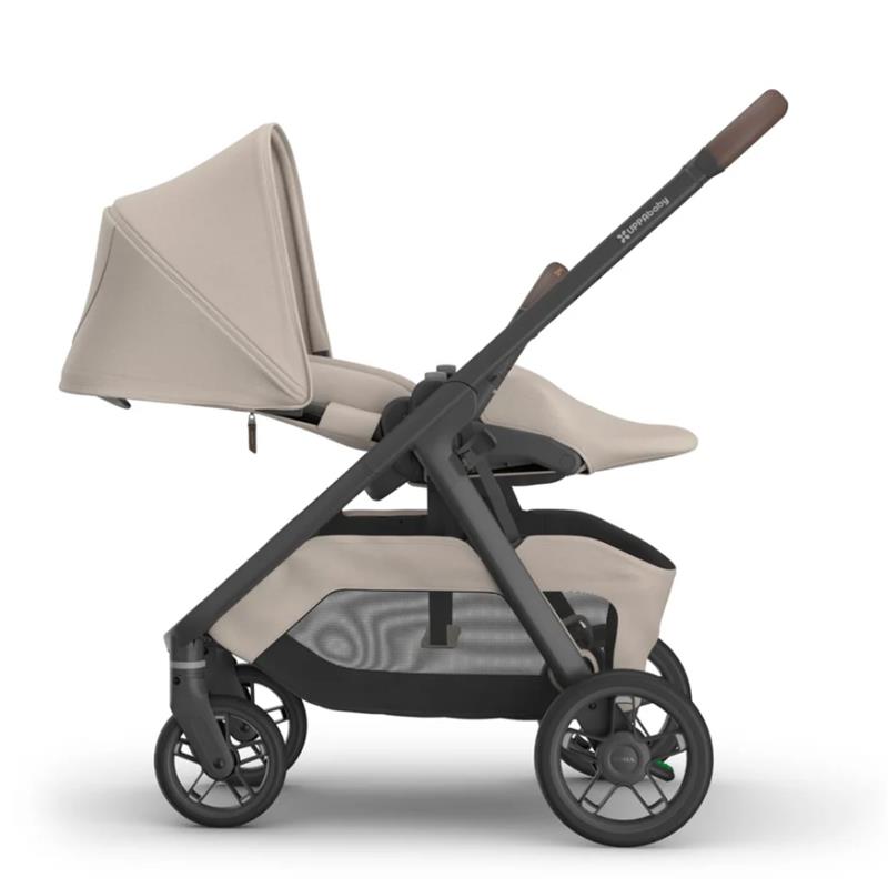 Uppababy Kona Stroller in Ada (Sandstone Mélange) with a beige seat and canopy, featuring a sleek black frame and wheels.