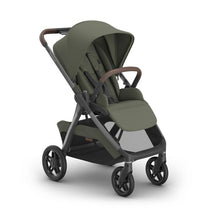 Uppababy Kona Stroller in Meadow Green with Graphite Frame and Chestnut Leather handle, featuring a sturdy design and spacious seat.