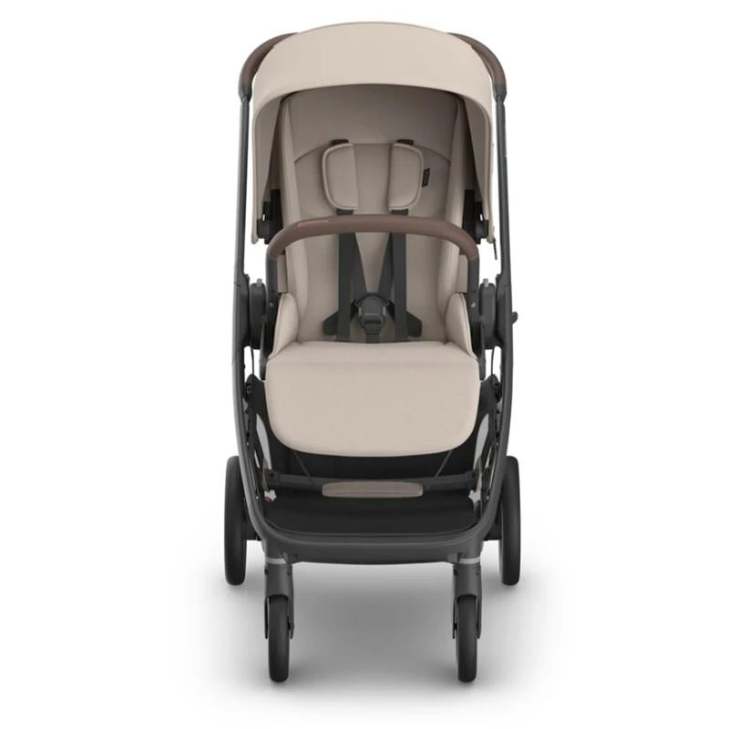 Uppababy Kona stroller in Ada (Sandstone Mélange) with an adjustable canopy and comfortable padded seat.