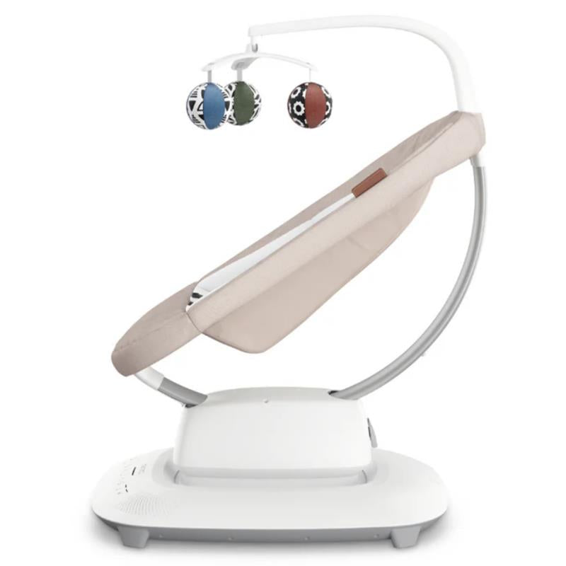 Uppababy Mamaroo Smart Swing in Charlie (Sand Melange) with a soft fabric seat and three hanging colorful toys.
