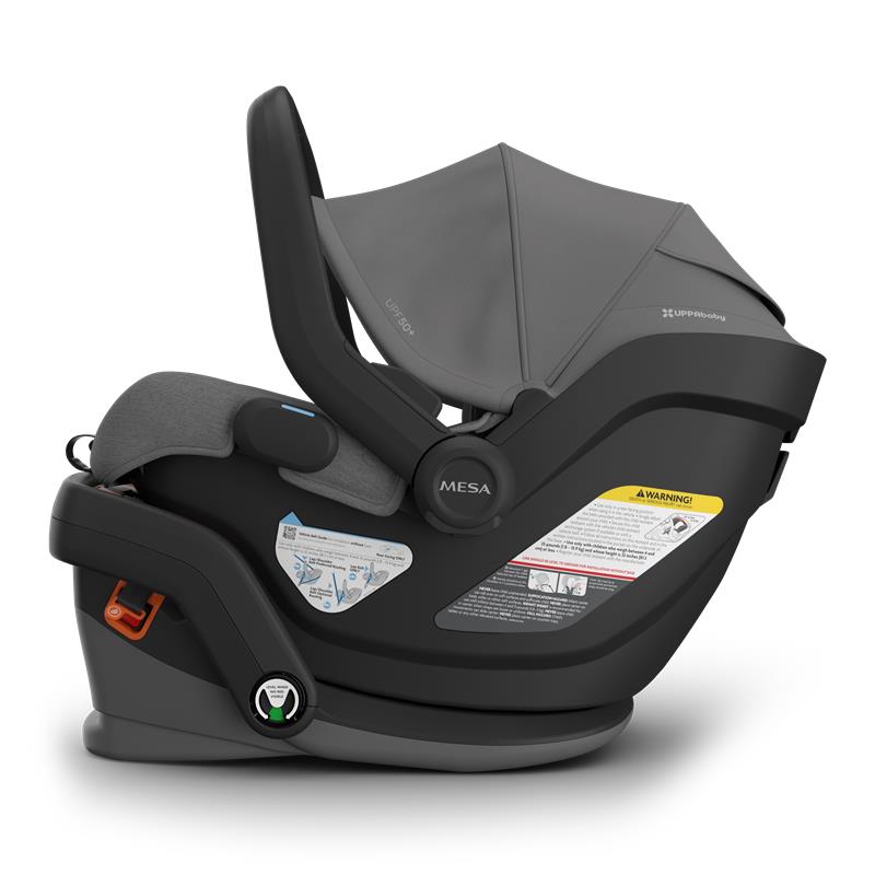 Uppababy Mesa V3 infant car seat in Greyson (Charcoal Mélange) with adjustable canopy and safety labels visible.