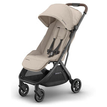 Uppababy Minu V3 stroller in Sandstone Melange fabric with Chestnut Leather handles; features a lightweight design and adjustable canopy.