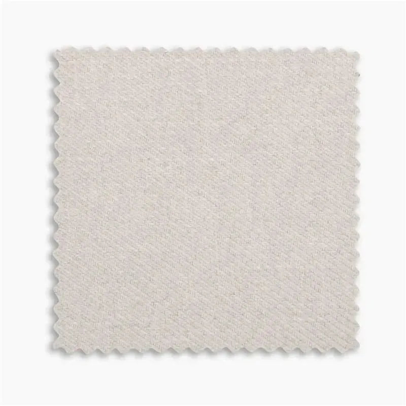 Light beige fabric swatch with a textured pattern, showcasing the color and material for the Uppababy Mira bouncer.