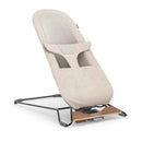 Uppababy Mira 2-in-1 bouncer and seat in sand mélange fabric with a silver frame and birch wood base.