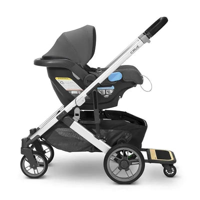 Uppababy Piggyback for Cruz V2, a baby board attached to a stroller, with a sitting surface for an older child.