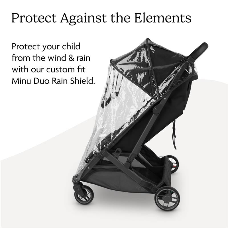 Uppababy Rain Shield for Minu V3 protects children from wind and rain, featuring a clear cover and black stroller frame.