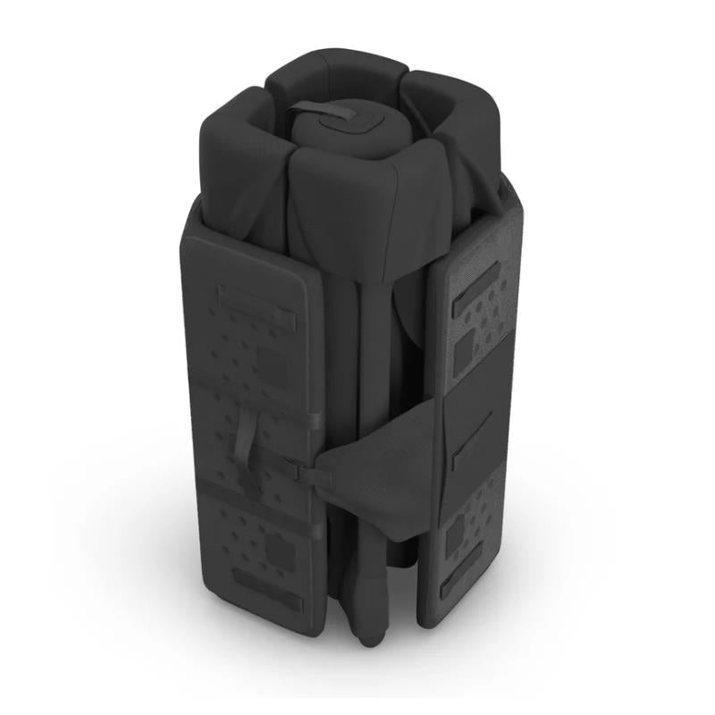 UPPAbaby Remi V2 Playard in Mason Black Soft Knit, presented in a compact, folded position with straps for secure closure.