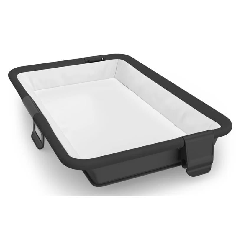 UPPAbaby Remi V2 Playard in Mason Black Soft Knit features a sleek design with a white interior and a sturdy black frame.