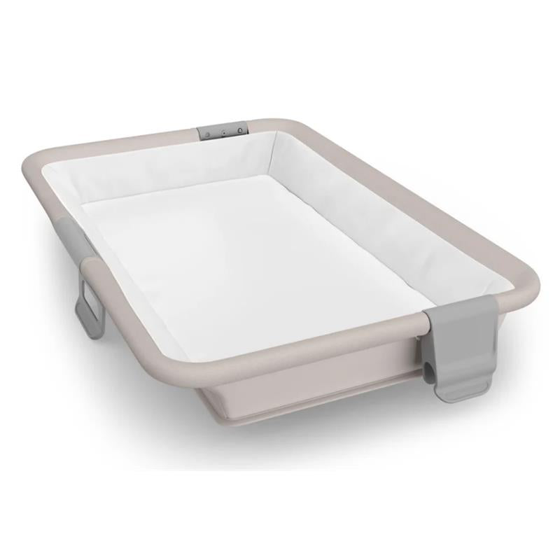 UPPAbaby Remi V2 Playard in Townsend Beige soft knit, featuring a spacious white interior with padded edges.