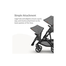 Uppababy Rumbleseat V3 in Dusty Blue Mélange with Carbon Frame and Chestnut Leather, featuring a simple attachment mechanism.