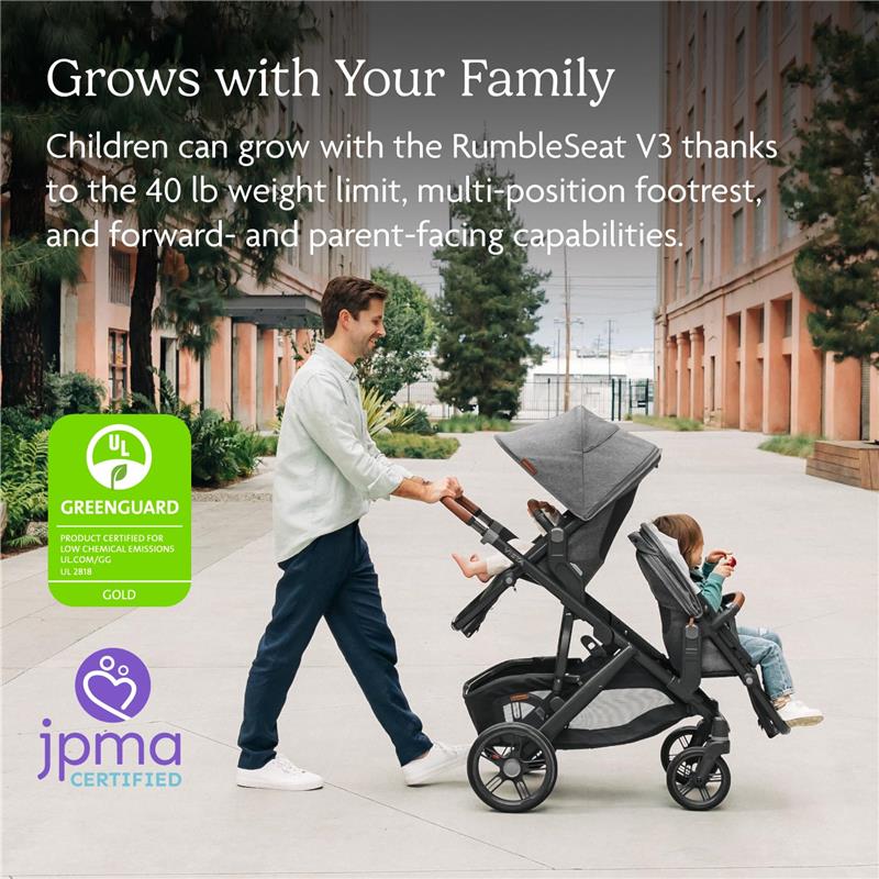 Uppababy RumbleSeat V3 in Stone Blue/Silver Frame/Sand Leather, with a parent and two children in a park setting.