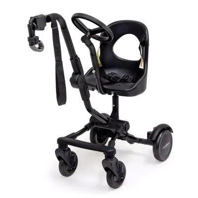 A black Valco Baby Co-Rider Ride-Along Seat featuring a small seat, adjustable handle, and four wheels for mobility.