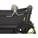 Portable baby stroller fan attached to a Veer stroller, featuring a flexible neck and gray body with yellow accents.