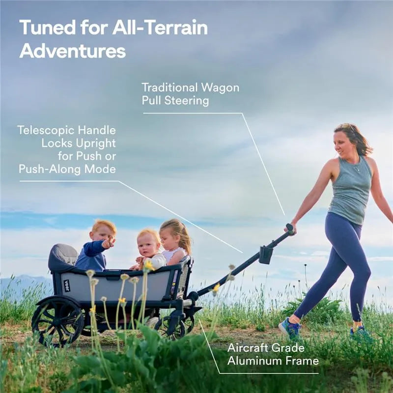 Veer Cruiser XL stroller wagon in grey, featuring a telescopic handle, durable aluminum frame, and two children seated inside.