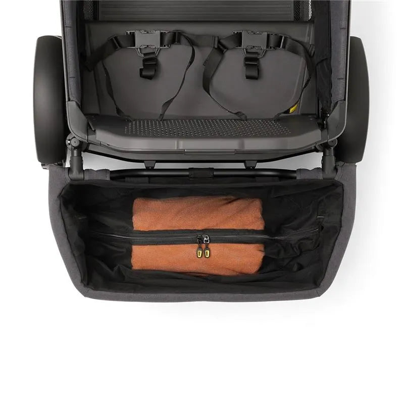 Rear foldable storage basket for Veer All-Terrain Cruiser XL, featuring an orange blanket inside.