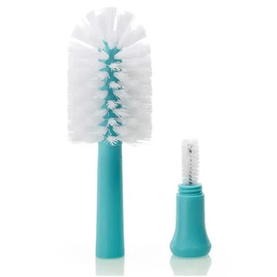 Two cleaning brushes for baby items are displayed: a larger turquoise brush with white bristles and a smaller brush.