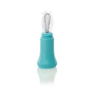 Cleaning brush for Vulli Mii Sophie La Girafe, featuring a teal handle and dual-sided brush head for effective cleaning.