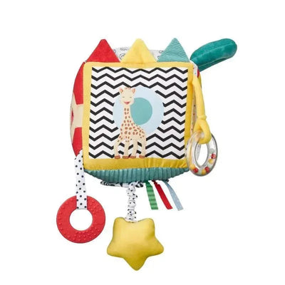 Sensory Cube featuring Sophie La Girafe, with colorful textures, rings, and tags for tactile exploration.