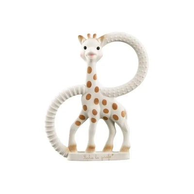 Sophie the Giraffe teether ring in white, featuring a smiling giraffe with brown spots and a textured ring for infants.