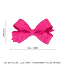 Tiny grosgrain hair bow in shocking pink, measuring approximately 2¾ inches across and 1½ inches tall.