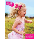 Medium antique white grosgrain hair bow with scalloped edges worn by a smiling girl in a pink dress, playing outdoors.