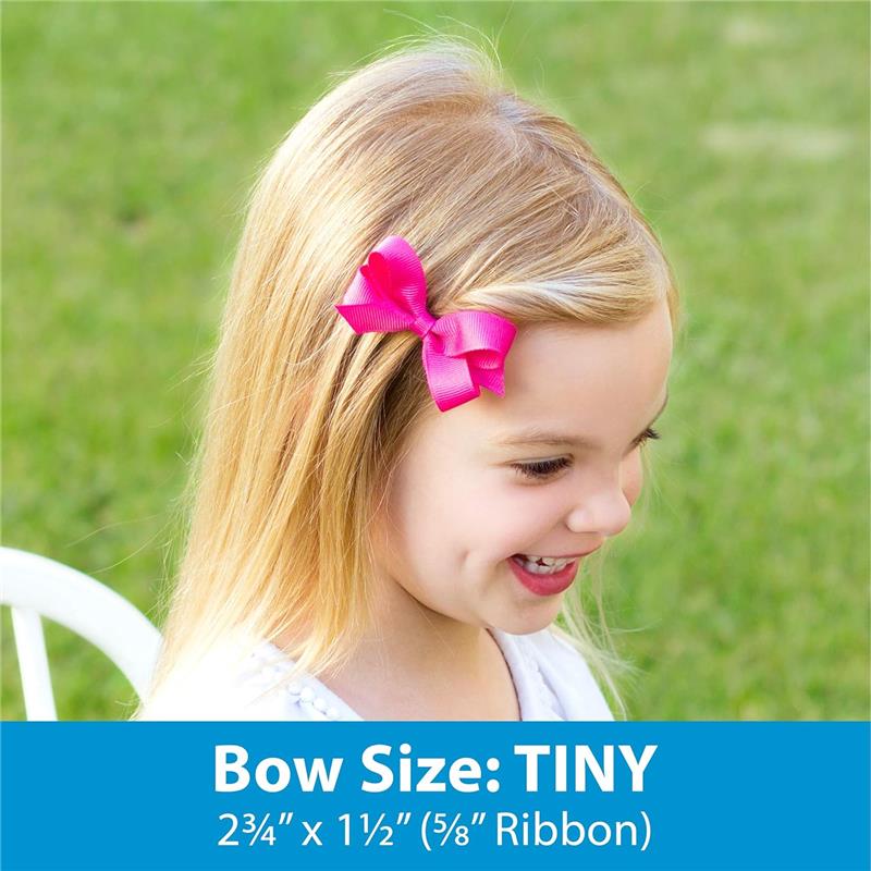 Classic grosgrain hair bow with scalloped edges in bright pink on a girl’s hair, showing size details below.