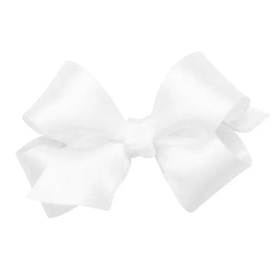 Classic white satin hair bow with a center knot, designed for girls and attached to a WeeStay clip.