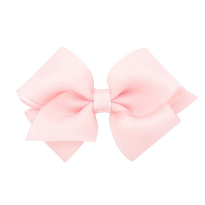Extra small light pink grosgrain hair bow with organza overlay on a WeeStay clip.