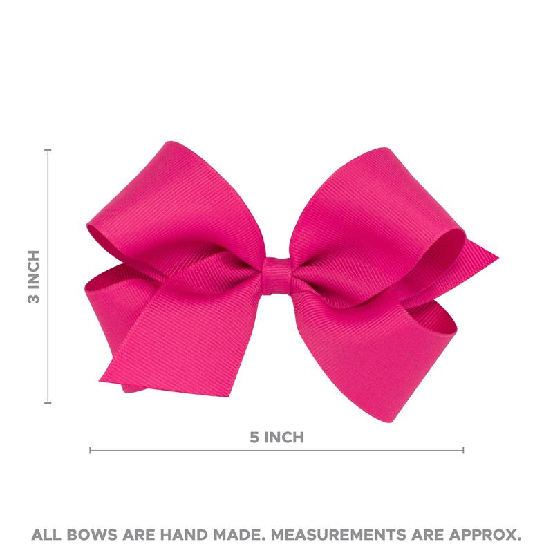 Classic pink grosgrain hair bow, measuring 5 inches wide and 3 inches tall, mounted on a no-slip hair clip.
