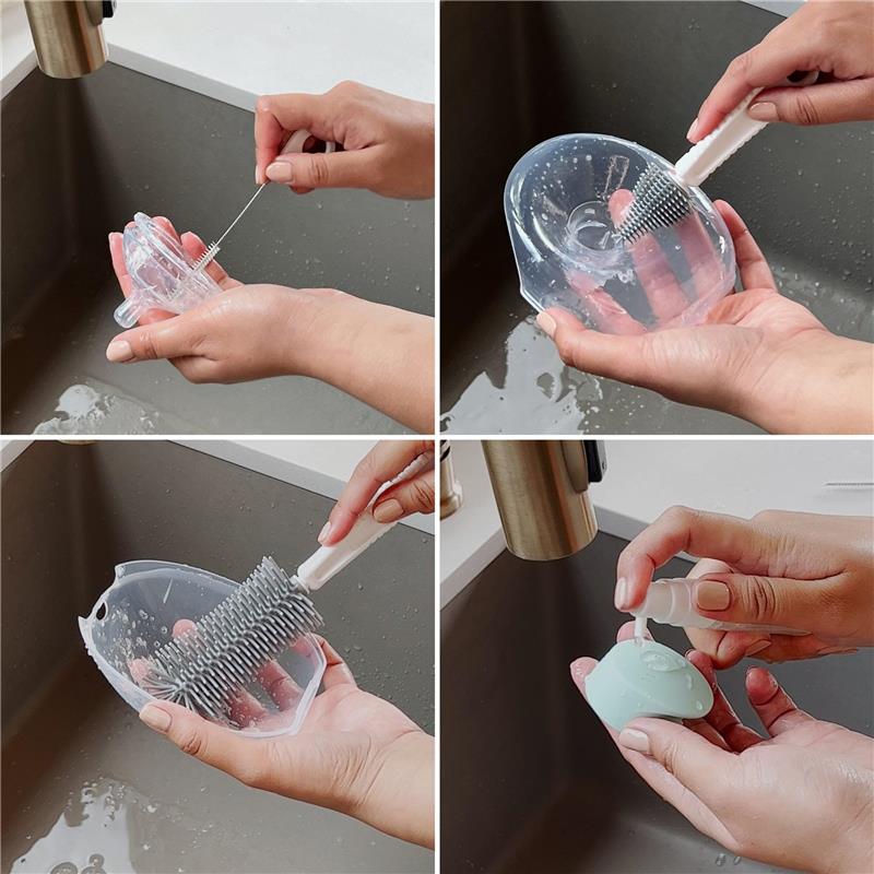 Hands cleaning a transparent travel cleaning kit with a brush and rinsing it under running water in a sink.