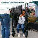 Wonderfold W2 Luxe Pro Stroller Wagon in Jet Black features a child sitting happily, showcasing a removable front and back frame for comfort.