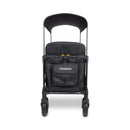 Quad stroller designed for up to four kids, featuring a sleek jet black color and durable wheels.