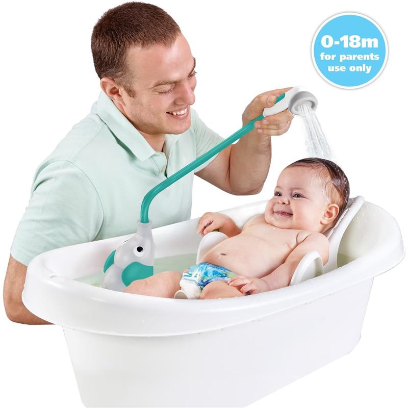 A man bathes a smiling baby in a white tub using the Yookidoo Elephant Water Pump shower head, featuring a trunk spout.