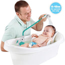 A man bathes a smiling baby in a white tub using the Yookidoo Elephant Water Pump shower head, featuring a trunk spout.