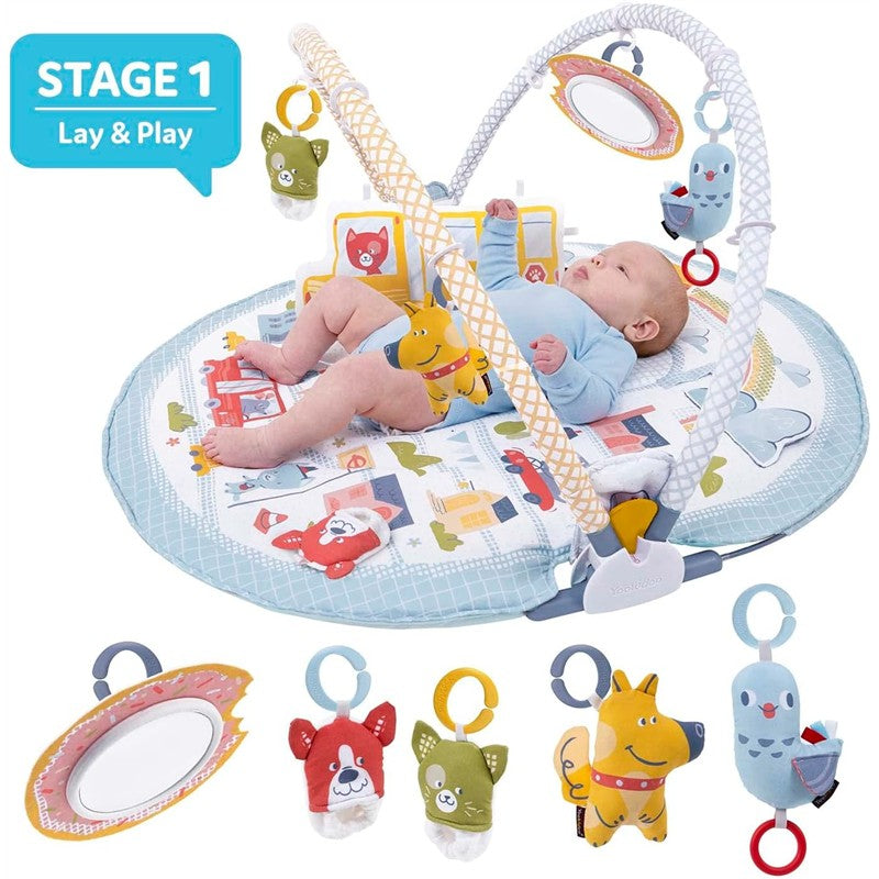 Yookidoo Baby Gym Lay to Sit-Up Playmat with a baby playing on a colorful activity mat, featuring dangling toys and a mirror.